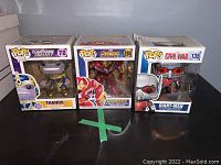 Three Marvel Funko Pop figures in original boxes: Thanos, Hulkbuster, Giant-Man.