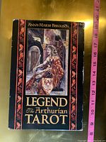 Front cover of the book 'Legend The Arthurian Tarot' by Anna-Marie Ferguson showing detailed medieval-themed illustration and title.