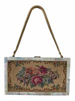Front view of the Ansico 1940s compact purse showing floral needlepoint panel, mother-of-pearl-like frame, and gold chain handle.