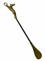 Full view of the brass rabbit shoehorn with handle, rod, and shoehorn end against a white background.