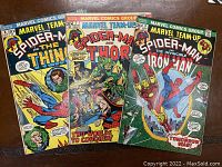 Three Marvel Team-Up comic books side by side showing front covers with Spider-Man and The Thing, Thor, and Iron Man respectively.