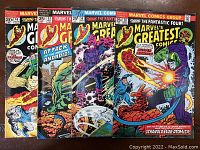 Photo showing the four Marvel's Greatest Comics Bronze Age comic books, issues #46, #53, #56, and #58, with their colorful covers visible.