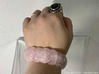 Rose quartz bracelet worn on wrist showing the size and style.