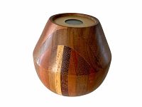 Faceted wooden kaleidoscope showing multi-tone wood shapes and polished finish.