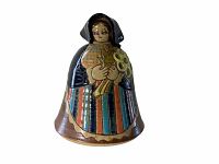 Front view of the stoneware figurine showing the woman figure holding a hole-pattern flower element, colors clearly visible