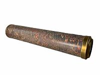 Side view of the kaleidoscope showing the marbled patterned body and brass end caps.