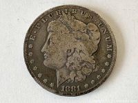 Obverse side of the 1881 O Morgan Silver Dollar coin showing Lady Liberty.