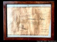 Full frontal view of framed map showing wood frame and map layout