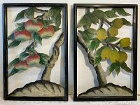 Pair of framed painted cut metal plaques showing fruit trees with apples and yellow fruits.
