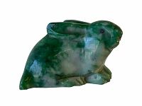 Close-up of the rabbit figurine showing green and white marbled stone with carved details