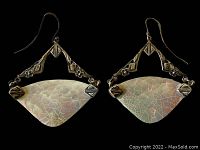 Pair of sterling silver and mother of pearl bohemian earrings against a black background, showing overall design and sparkle.