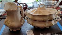 Set includes two tureens with lids and one pitcher with repaired crack, all show wear and crazing