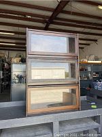 Full view of the three stacked wooden barristers cabinet sections with glass front doors