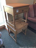 Two stacked pine side tables with single drawers and pegged construction shown together