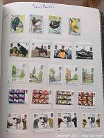 First album page showing modern mint commemorative stamps featuring birds, industry scenes, landmarks, flags and dogs