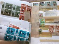 Sheet showing blocks of green, orange, blue and brown stamps depicting Olympic runners