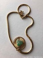 Full 14kt yellow gold flattened 4mm snake chain with pendant