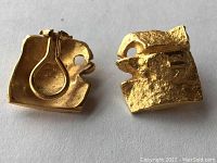 Front and back view of both earrings