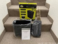 Complete lot contents showing shredder unit, waste bin with liner, user manual, and original packaging.