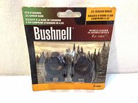 Front view of new Bushnell 22 airgun rings in original packaging showing branding and product details.