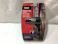 Front view of new Bushnell magnetic boresighter in original blister packaging with red and forest background design.