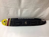 Top side of the Butler Creek sling strap showing comfort stretch material and branding.