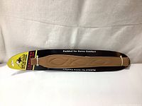 Full view of the Butler Creek Cobra Sling packaged showing padded suede and leather sections, sealed in original packaging.