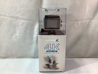 Photo of the Safari 4K Action Camera in packaging showing front branding and camera inside clear case.