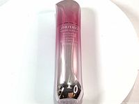 Front view of Shiseido White Lucent Micro Targeting Spot Corrector bottle showing gradient pink to silver color and product name.