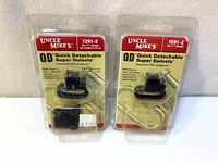 Front view of two Uncle Mike's QD Quick Detachable Super Swivels 1391-2 and 1591-2 in original packaging, showing product and branding.