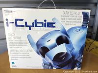 Front view of i-Cybie robot box with branding and caution text