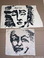 Two block print artworks by Aaron Cobbett, one smaller on cloth with paint marks and one larger on textured paper, showing black ink abstract portraits.