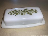 Closed butter dish showing the top lid with the Crazy Daisy floral pattern.