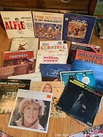 Photo showing a collection of vintage vinyl LP records including Alfie, Dave Brubeck Quartet, Oliver!, Ethel Merman Gypsy, Glen Campbell, Dionne Warwick, Anne Murray, Judy Collins, Snyder Bernstein Mendelssohn, Bobby Gentry, Earthen Vessels, Carousel, Herbie Mann albums.