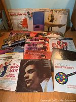 Photo showing an overview of the vinyl record collection including Paul Simon The Graduate, Flower Drum Song, Chuck Mangione, The Music Man, Johnny Mathis, Robert Goulet, Breck Hootenanny and other albums.