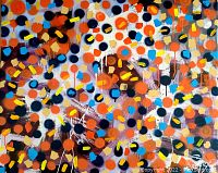 Close-up of painted surface showing multicolored circular and brushstroke details