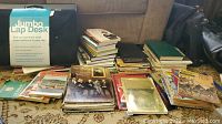 Wide view of stacked books and magazines with Jumbo Lap Desk label visible