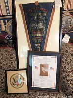 Full view of the displayed GAR Gettysburg banner and the two framed prints included in the lot.