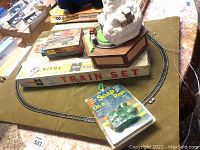 N gauge train set box with track pieces and packaged soap on a rope shaped like a train.