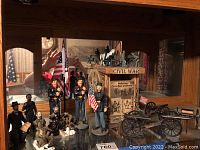 Wide shot of all Civil War themed items including birdhouse, soldier figurines, cannons, and horse miniatures