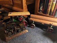 Both locomotive models displayed together on carpeted surface