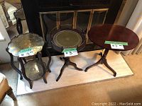 All three tables arranged side by side in front of a fireplace