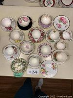 Overhead view of all teacups and saucers in the lot