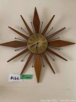 Full front view showing complete starburst shape and dial