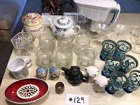 Full lot including shrimp bowls, ceramic teapots, salt and pepper shakers, biscuit container, clear glasses and small amber jar