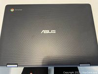 Top cover showing textured finish with Chrome and Asus logos