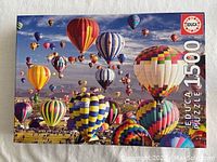 Photo of Educa puzzle box depicting colorful hot air balloons scene and 1500 piece count.