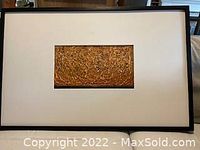 Framed encaustic painting "Fire Storm" with white mat and narrow dark frame, showing full front view of the artwork.
