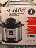 Box showing InstantPot Lux 6-in-1 Multi-Use Programmable Pressure Cooker with features and branding.