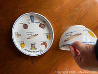 Small plate and matching bowl set shown from above and side, illustrating French pastry designs and condition details including two chips on the bowl.